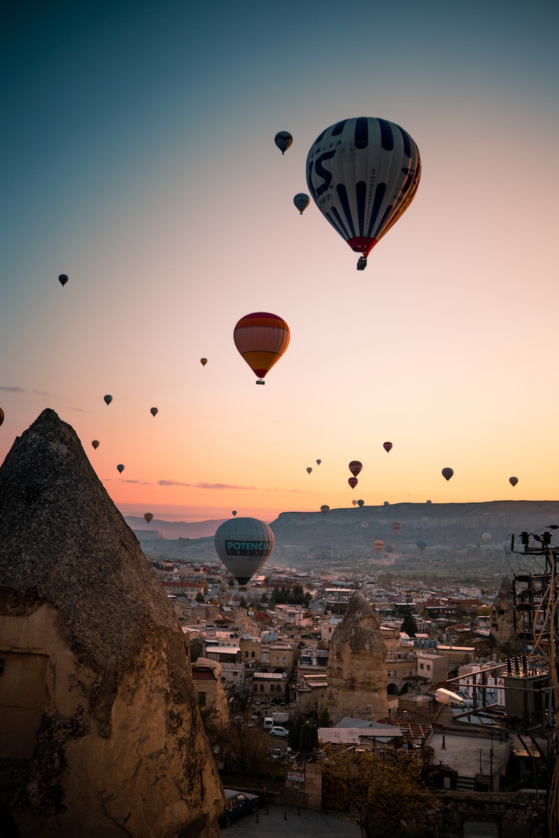 Hot Air Balloons Flying over the City